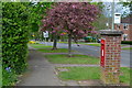 Brick pillar box and view down Hightown Road in OX16 9FR