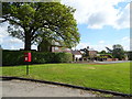 Elizabeth II postbox on the A525, Bangor-on-Dee in LL13 0AY