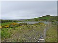Glendrissaig reservoir and a distant view of Girvan in KA26 0LS