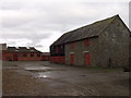 Stone barn and brick buildings at Trehelig Farm in SY21 8SG