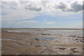 Sandy beach with patches of pebbles by the mouth of the River Lunan in DD11 5ST