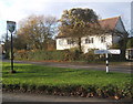 House, lane junction and village sign, Whatfield in IP7 6RZ