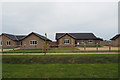 New bungalows on former arable field in IP25 7BW