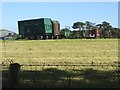 Trailers and hay turner at Watch Currock Farm in NE46 2NT