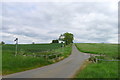 Twyford Road crossing a stream and leading up to Hill Top Farm in LE7 9LQ