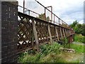 Rusty footbridge over the railway in DE15 9HT