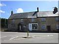 Shop and houses at the entrance to Hall Hill, Brigstock in NN14 3HA