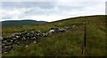 Fence and wall between Grey Weather Law and Pykestone Hill in EH45 9JU
