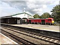 Freight train passes through Westbury Railway Station in BA13 4FJ