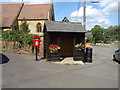 Elizabeth II postbox and bus shelter on Stocks Hill Silverstone in NN12 8FE