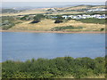 Littlesea Holiday Park seen across Lynch Cove in DT4 9DN
