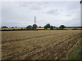 Electricity pylon in a harrowed field in Newton and Little Oakley