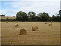 Stubble field with bales near Chilton Street in CO10 8QT