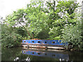 Semi-derelict narrowboat on the Grand Union Canal southwest of Harefield in UB9 6JG
