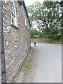 Cyclist passing the old schoolroom in SA62 3NN