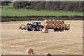 Tractor bringing in the Crops in DG9 0JQ