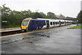 New diesel multiple unit departs Barrow Station heading for Manchester Airport in LA14 2UT