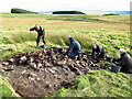 Excavating a stony mound, Fawdon Hill in NE19 1NP