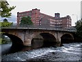 Belper - road bridge and North Mill from River Derwent path in DE56 2BY