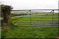 Field gateway from north side of minor road east of Low Moresby in CA28 6RY