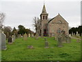 Kettins Parish Church and part of its burial ground in PH13 9JW