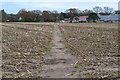 Path across stubble field near Heatherstone Grange in BH23 8AU