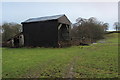 Battered Black Barn beside Kex Beck in BD23 6HJ