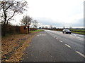 Bus stop and shelter on the A7 near Sandysike in CA6 5SY