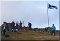 Saltire and bagpipes at Lee Pen summit in EH44 6RL