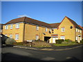 Low rise flats on Chequers Close, Oakley Vale in NN18 8SQ