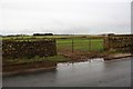 Field gateway on SW side of rural road in CA11 8TA