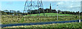 Pylon, motorway and church in G69 6BT