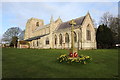 Old Leake War Memorial and church in PE22 9NJ