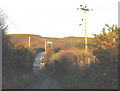 Approaching the T-junction north of Pen-y-Bont Farm in Llanengan Community