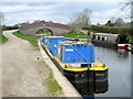 Narrow boats moored by New Marton Bridge, Llangollen Canal in SY10 7BW