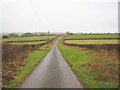 Road through hill farm pastures in LD3 0UL