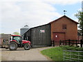 Tractor in the farmyard in SY12 9AA