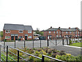 New and old housing on Thorpe Road, Middleton in LS10 4WJ