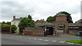 Bus shelter and a courtyard, Green Lane, Low Crosby in CA6 4QU