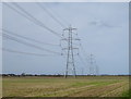 Pylons in stubble field in YO60 7QU