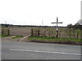 Field entrance and finger post off West Lane in YO61 1LS