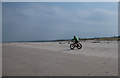 Cycling on Nairn Beach in IV12 5BY