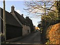 Looking down Bessell Lane from The Corner, Iwerne Courtney, Dorset in DT11 8PY