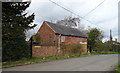 Brick built farm building on Main Road in ST20 0QG