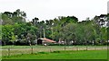 Outbuildings and horses near Gaveston Hall in RH13 6RF