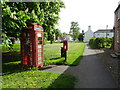 Elizabeth II postbox and telephone box on Main Road, Weaverthorpe in Weaverthorpe