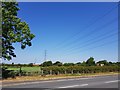 Powerlines cross the A38 near Greenfields, Stoke Heath in B61 7EL