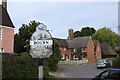 Bourn village sign and Home Farm across the road in CB23 2YY