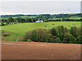 View across farmland to Mid Priestgill in ML10 6PS