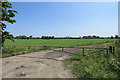 A field gate with a view towards radio telescopes in CB23 1EU